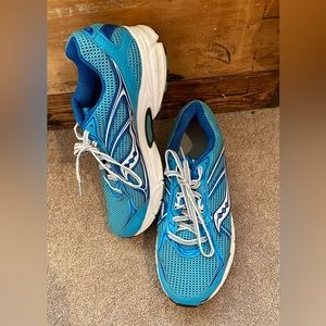 Women’s size 9.5 Saucony running shoes, blue and white.